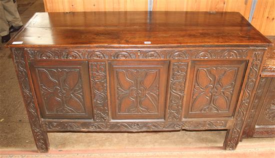 An 18th century carved oak coffer, W.4ft 7in.